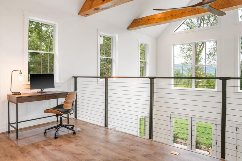 A work desk by the loft windows