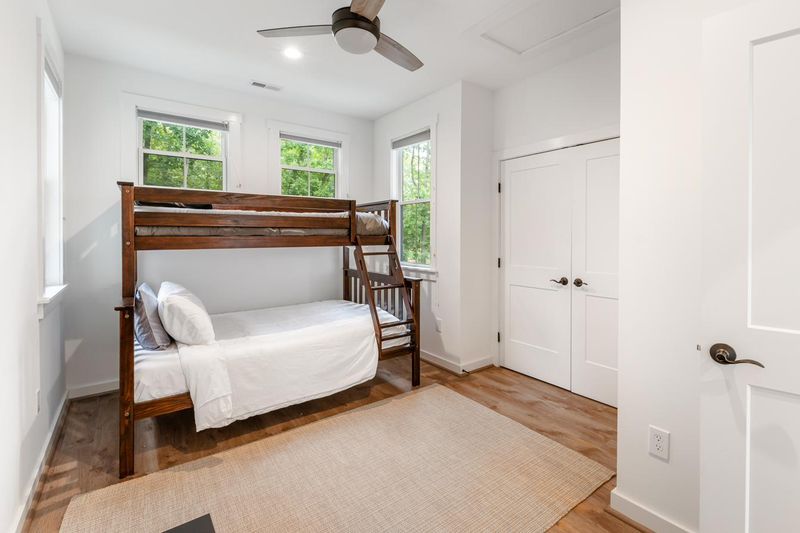 The bunk room, with a full bed below and a twin above